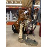A LARGE FIGURE OF TWO REARING HORSES HEIGHT 36CM AND A RED INDIAN ON HORSEBACK WITH A LADY BESIDE