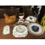 A COLLECTION OF CERAMICS TO INCLUDE CHEESE DISHES, A HEN EGG CROCK, A PENGUIN BISCUIT BARREL,