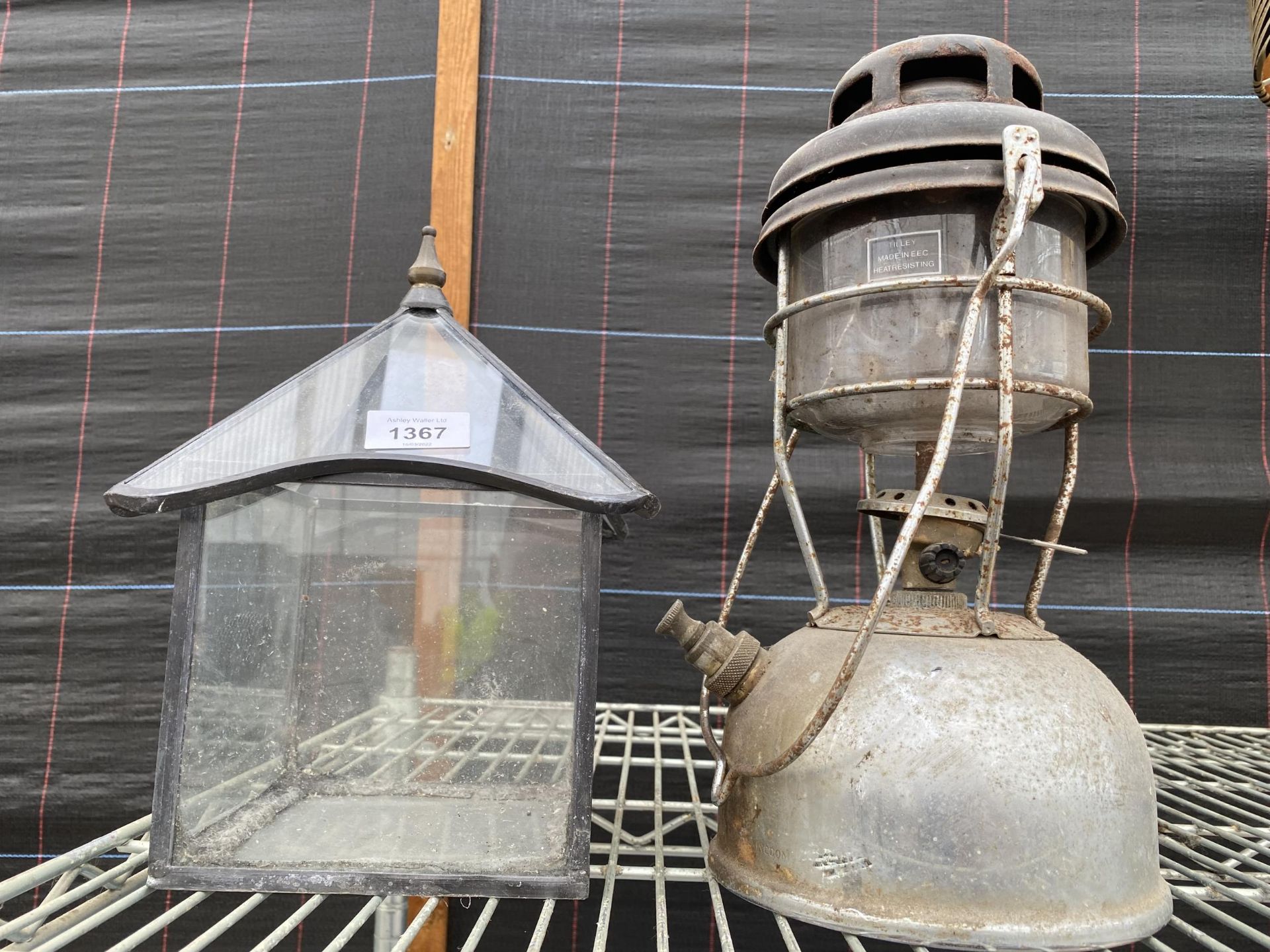 A VINTAGE PARAFIN LAMP AND A FURTHER CANDLE DOME