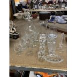 A QUANTITY OF GLASSWARE TO INCLUDE, CANDLE HOLDERS, VASES, GLASSES, JUG, ETC