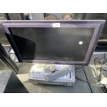 A PANASONIC 22" LCD TELEVISION AND A BUSH VHS PLAYER BOTH WITH REMOTE CONTROL