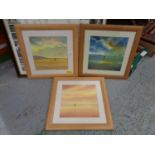 THREE PINE FRAMED WATERCOLOURS OF A COUPLE HAND IN HAND WALKING DOWN A BEACH SIGNED G HEATON