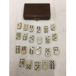 A BOXED VINTAGE INCOMPLETE MINIATURE SET OF BONE DOMINOES