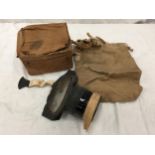 A BRITISH 1941 GAS MASK IN ORIGINAL BOX OF ISSUE IN CANVAS CASE, CANVAS BAG WITH ANTI DIMMING MK