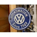 A CAST BLUE VOLKSWAGON SIGN