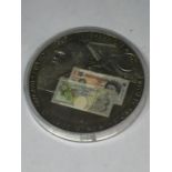A PROOF TEN POUND COIN IN A CAPSULE
