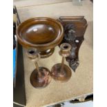 A PAIR OF TREEN CANDLESTICKS AND A TREEN FRUIT BOWL