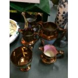 A SET OF FIVE GOLD COLOURED WITH FLORAL DECORATION JUGS PLUS A GOBLET - TWO A/F