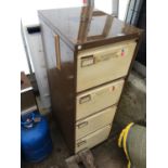 A METAL FOUR DRAWER FILING CABINET AND AN A BOARD