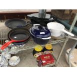 AN ASSORTMENT OF POTS AND PANS TO INCLUDE A CAST IRON GRIDDLE PAN AND A CAST CASAROLE DISH ETC