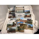 A LARGE COLLECTION OF APPROXIMATELY 500 SLEEVED VINTAGE POSTCARDS, CONSISTING OF MOSTLY ALL