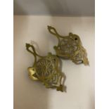 TWO BRASS TRIVETS LENGTH 25CM