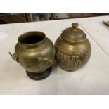 AN ORNASTE LIDDED JAR STAMPED WITH MADE IN BRITISH INDIA HEIGHT 18CM AND A BRASS JAR DECORATED