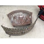 A VINTAGE CAST IRON FIRE GRATE AND FIRE FRONT