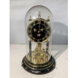 AN ANNIVERSARY CLOCK WITH GLASS DOME AND FLORAL DECORATION