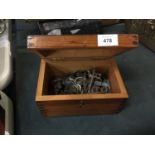 A PINE BOX CONTAINING VINTAGE KEYS