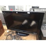 A PANASONIC 32" TELEVISION WITH REMOTE CONTROL