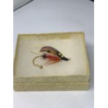 A SALMON FLY BROOCH IN A PRESENTATION BOX