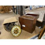 A CLOCK FACE AND WORKINGS IN NEED OF REPAIR, A CORNER WALL SHELF WITH A LION AND A MAHOGANY WOODEN