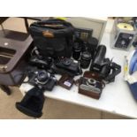 AN ASSORTMENT OF CAMERA EQUIPMENT TO INCLUDE A PENTAX TAKUMAR 1:3.5/135 LENS, A PENTACON 4-5.6/55-