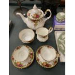 ROYAL ALBERT COUNTRY ROSES TEAWARE TO INCLUDE, A TEAPOT, CREAM JUG, SUGAR BOWL AND TWO CUPS AND