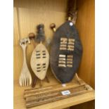 AN ASSORTMENT OF TRIBAL TREEN ITEMS TO INCLUDE TWO DECORATIVE SHIELD AND SPEAR PIECES ETC