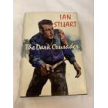 A FIRST EDITION HARDBACK 'THE DARK CRUSADER' BY IAN STUART WITH DUST COVER. PUBLISHED BY COLLINS