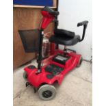 A WHEELTECH SHOP MOBILITY SCOOTER WITH KEY AND CHARGER BELIEVED IN WORKING ORDER BUT NO WARRANTY