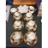 A QUANTITY OF ROYAL ALBERT 'COUNTRY ROSES,' TO INCLUDE, SIX TRIOS, CREAM JUG, SUGAR BOWL, SANDWICH
