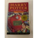 A FIRST EDITION (30TH PRINT) HARRY POTTER AND THE PHILOSOPHER'S STONE PAPERBACK BOOK BY J.K.