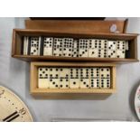 TWO WOODEN BOXED SETS OF DOMINOES