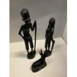 A GROUP OF THREE CARVED EBONY AFRICAN FIGURES TO INCLUDE, TWO MEN AND A DEER