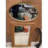 A GILT FRAMED WALL MIRROR AND A FURTHER PINE FRAMED WALL MIRROR