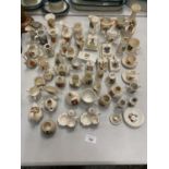 A LARGE QUANTITY OF MINIATURE CRESTED WARE PORCELAIN TO INCLUDE, JUGS, CUPS, VASES, ETC