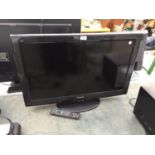 A PANASONIC 32" TELEVISION WITH REMOTE CONTROL