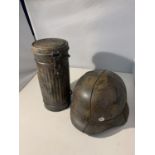 A REPRODUCTION GERMAN HELMET AND GASMASK CANISTER