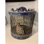 AN ORIENTAL CLOISONNE BIRD CAGE WITH MINATURE CHINESE YEAR FIGURES TO THE TOP (ONE A/F) WITH A