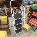 A FOUR RUNG TUBULAR METAL STEP LADDER