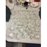 A LARGE QUANTITY OF DRINKING GLASSES - SOME CUT GLASS - TO INCLUDE, WINE, BRANDY, WHISKEY, SHERRY,