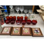 AN ASSORTMENT OF GLASS WARE AND FRAMED FLORAL CERAMIC PLAQUES ETC