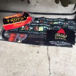 AN ASSORTMENT OF PUB BRANDED BEER CLOTHES AND MATS