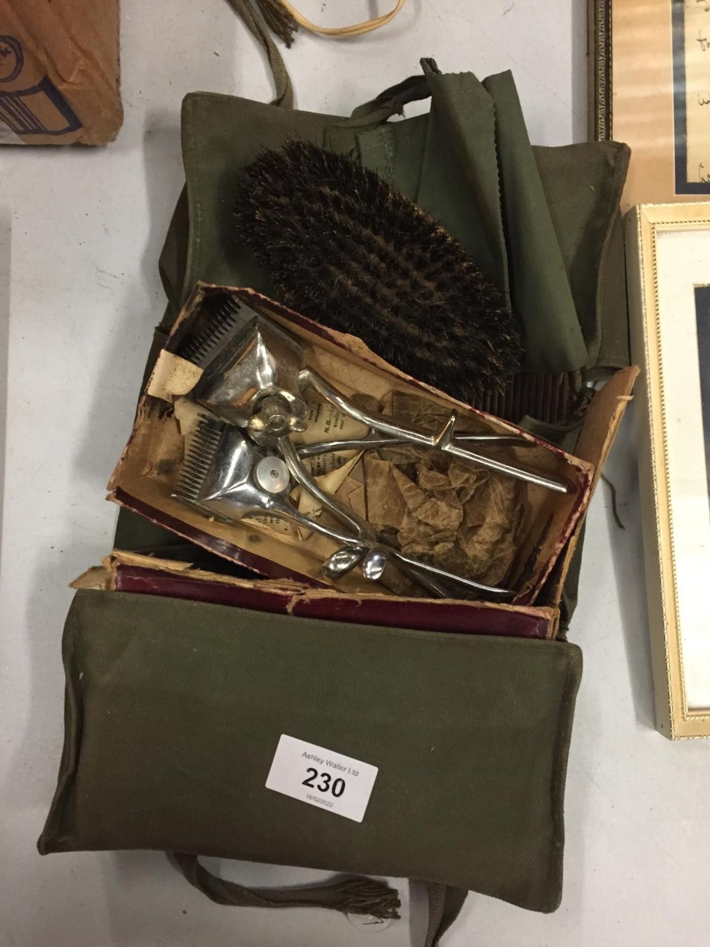 A VINTAGE BOXED HAIR CLIPPERS SET IN A CANVAS CASE