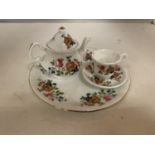 A MINIATURE CHINA TEA SET FOR ONE