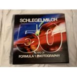 A HARDBACK FIRST EDITION SCHLEGELMILCH 50 YEARS OF FORMULA ONE HISTORY PUBLISHED BY KONEMANN IN 2012