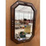 AN OAK FRAMED OCTAGONAL WALL MIRROR