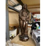 A STATUE OF A CLASSICAL LADY IN A BRONZE COLOUR. HAS REG NO 300456 JAN 1897. HEIGHT APPTROX 48CM