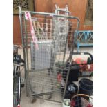 A METAL FOUR WHEELED STORAGE CAGE