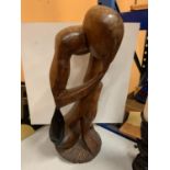 A LARGE WOODEN CARVED FIGURE HEIGHT APPROXIMATELY 66CM