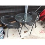 A BSTRO SET WITH GLASS TOPPED ROUND TABLE AND TWO RATTAN CHAIRS