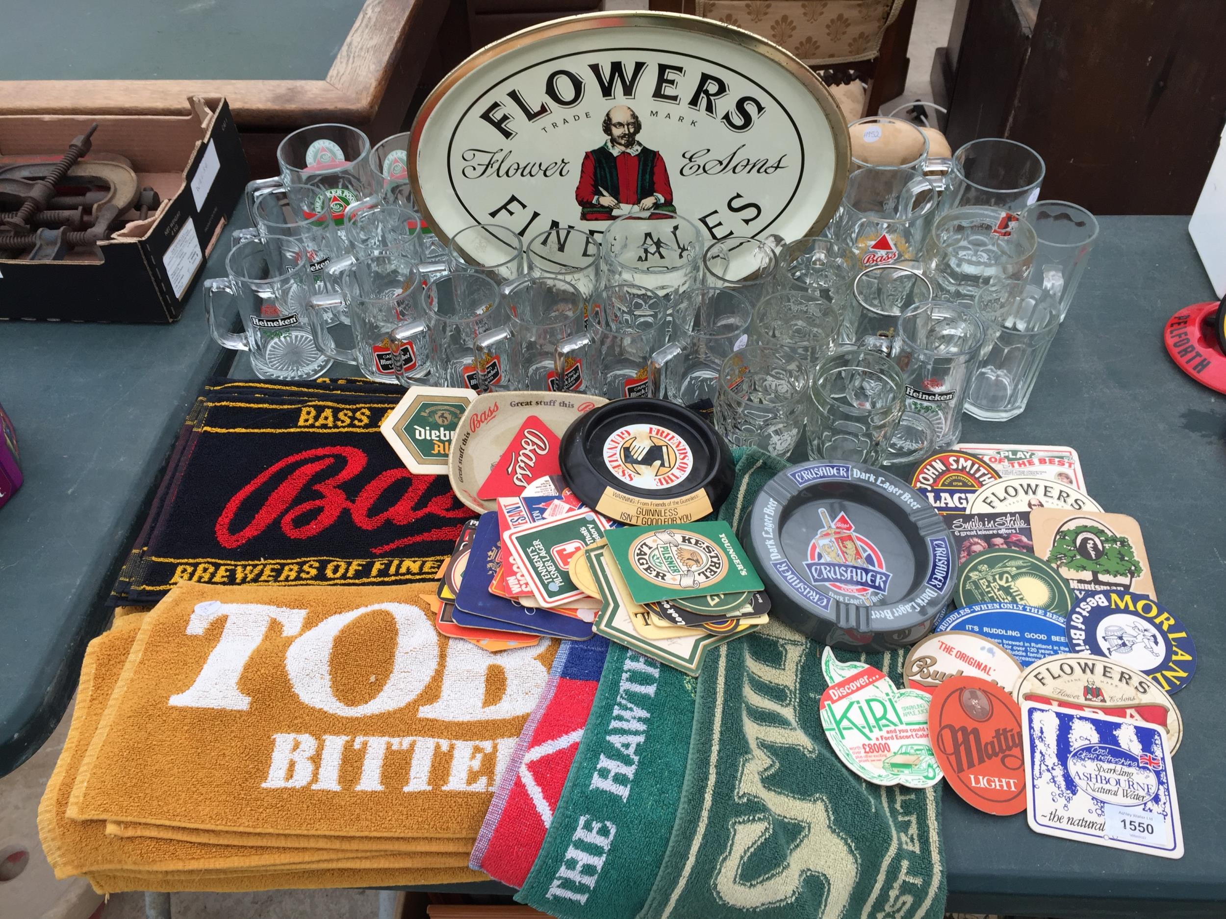 AN ASSORTMENT OF BRANDED PUB ITEMS TO INCLUDE GLASSES, TRAYS AND BAR CLOTHS ETC